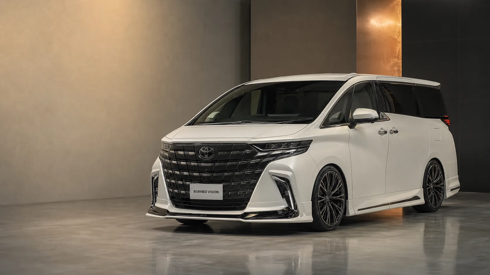 Editorial concept visual for choosing a styling direction on a Toyota Alphard 40 executive MPV — deep monotone paint with coordinated aero