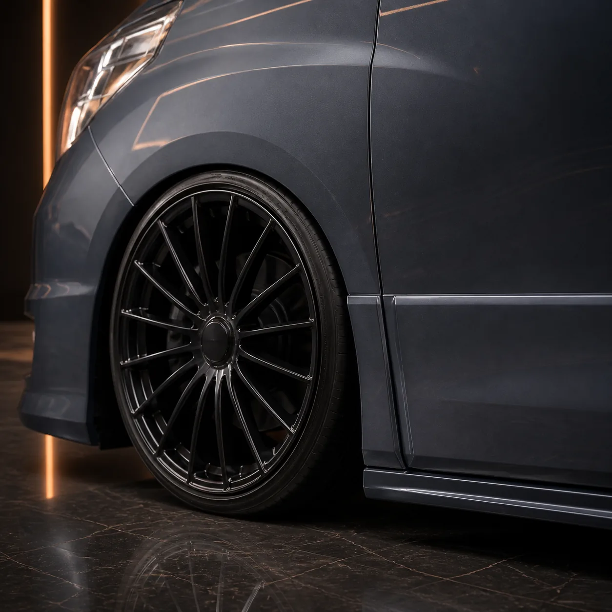 Toyota Alphard 20 early blank-centre black turbine wheel and side-step AI concept detail