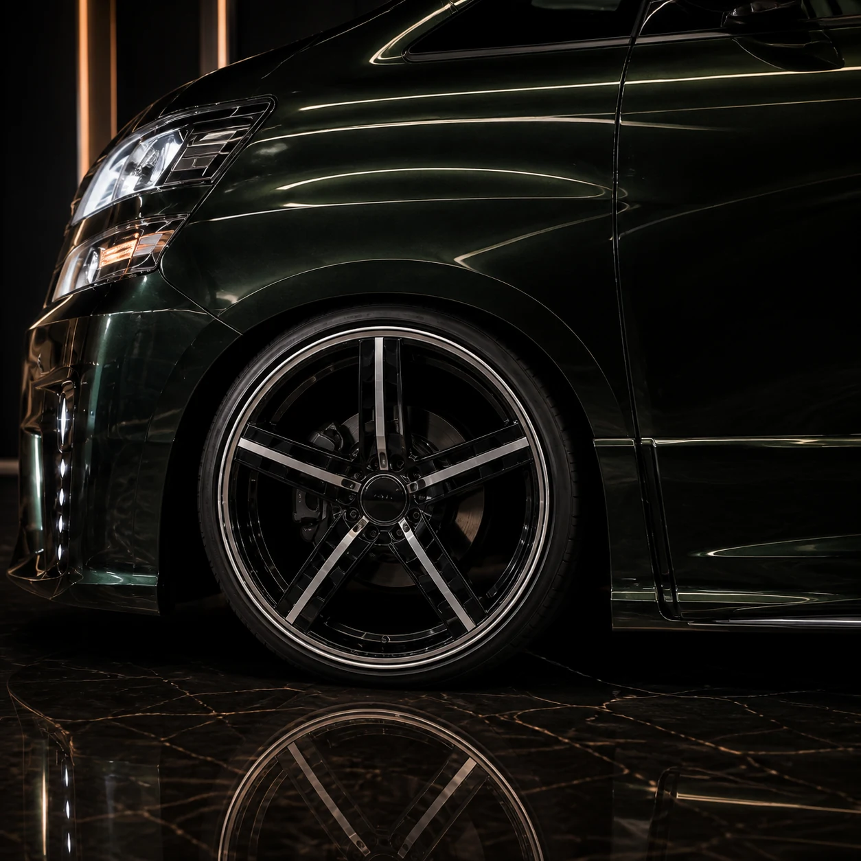 Toyota Vellfire 20 early black blank-centre wheel arch and Grand Tourer side-step AI concept detail
