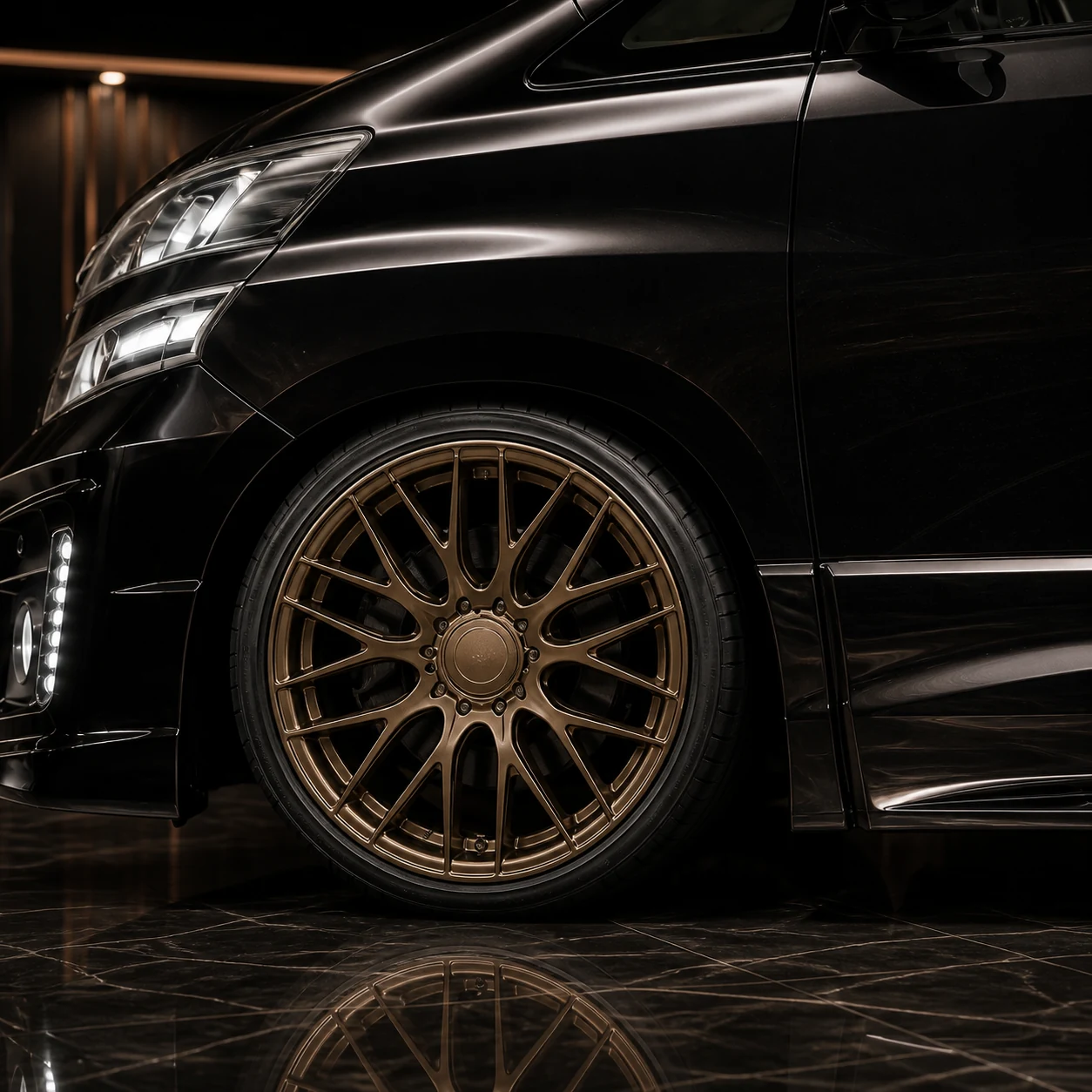 Toyota Vellfire 20 early bronze blank-centre wheel arch and Z-grade side-step AI concept detail